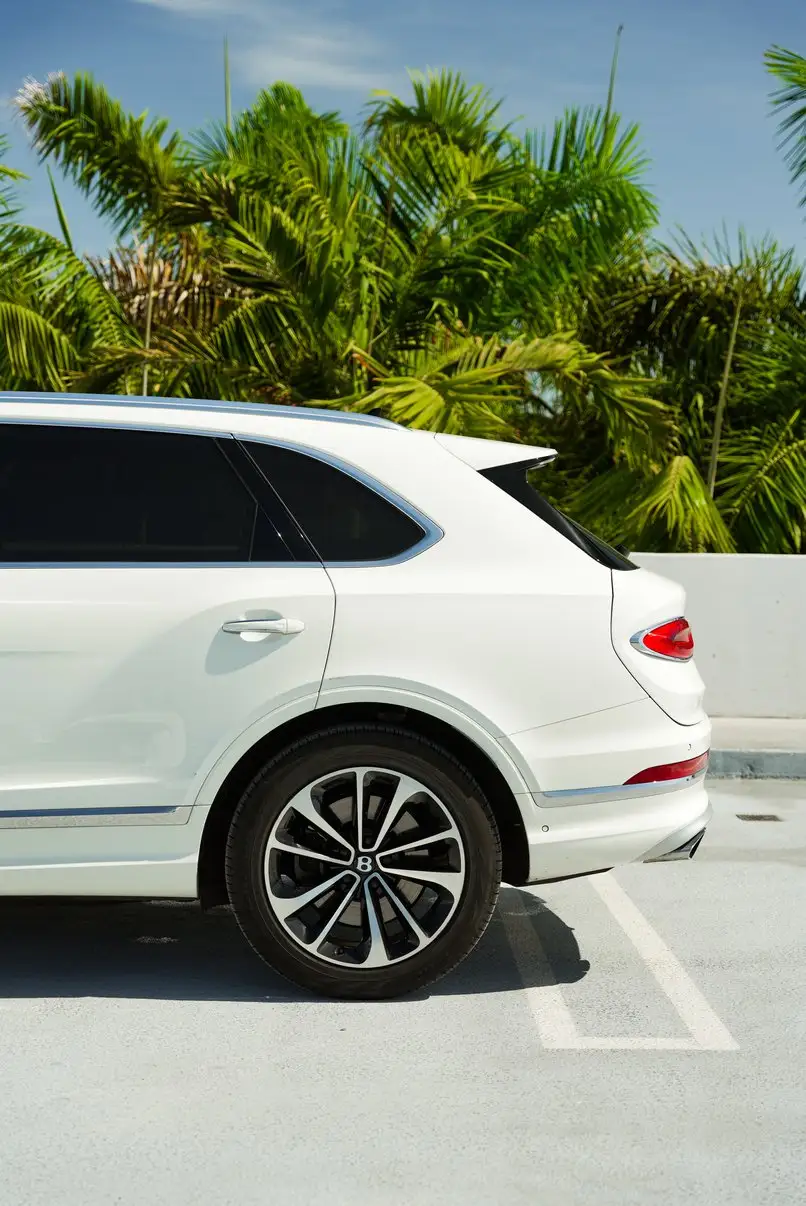 White Bentley Bentayga parked on a Miami rooftop