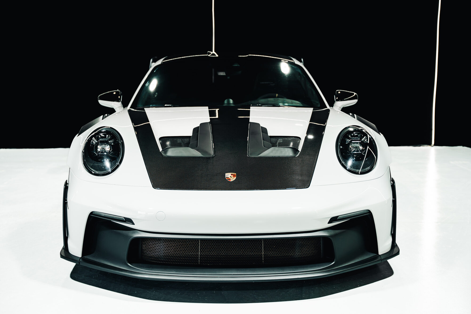 White Porsche 911 GT3 RS parked on a Miami rooftop